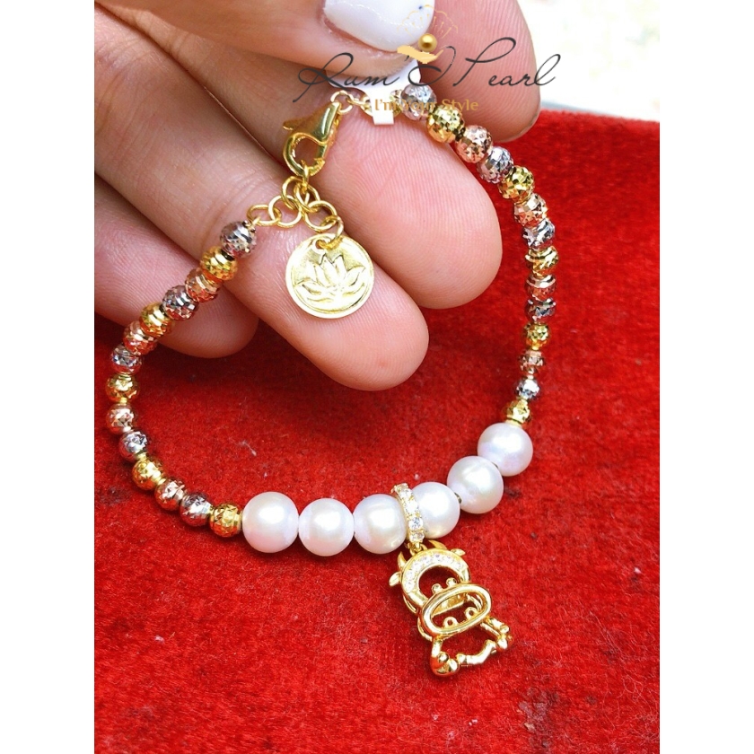Vòng tay vàng 18K phối ngọc trai và charm 